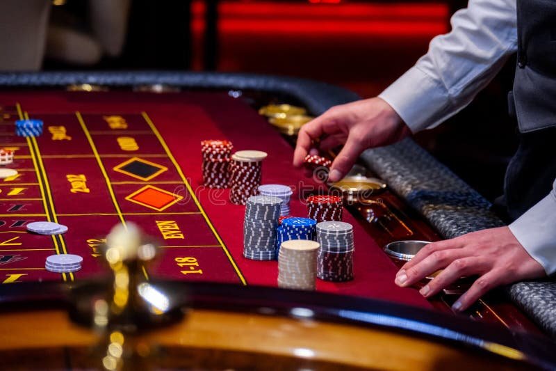 Mobile phone displaying live dealer roulette table interface